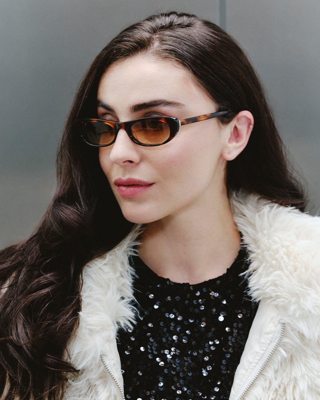 Mira Ecaille sunglasses — butterfly frame, worn by a woman
