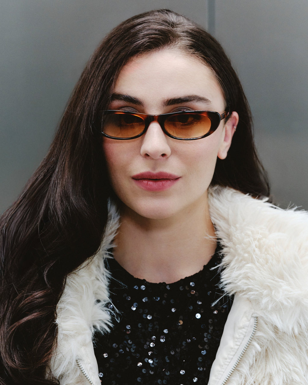 Mira Ecaille sunglasses — butterfly frame, worn by a woman