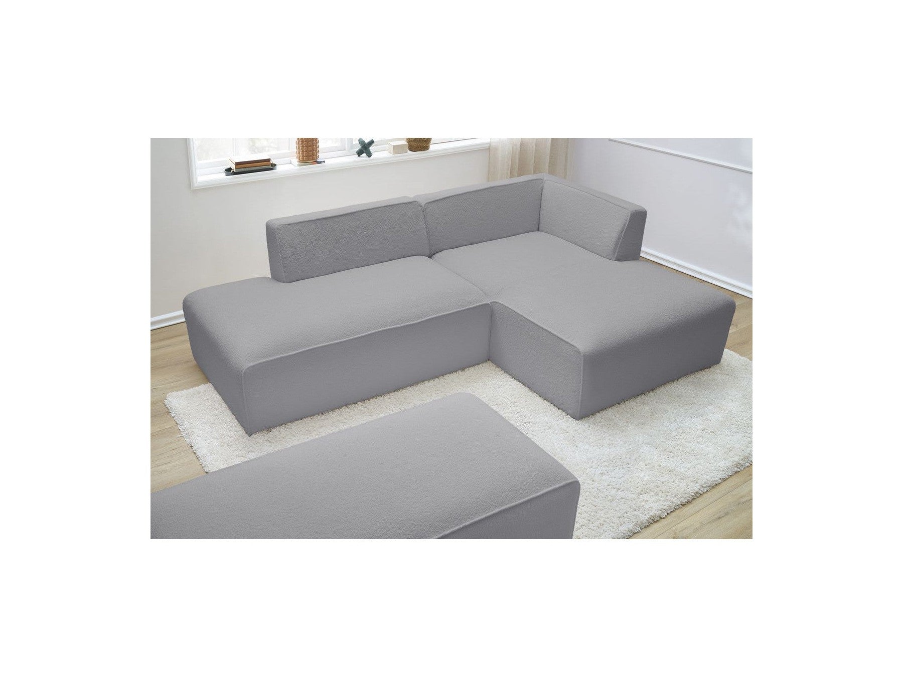 Megeve - Sofá esquinero fijo modular - Tela bouclé - Con puf - Esquina derecha