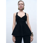 Top de punto fino con peplum