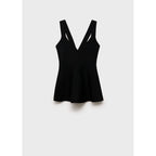 Top de punto fino con peplum