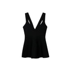 Top de punto fino con peplum
