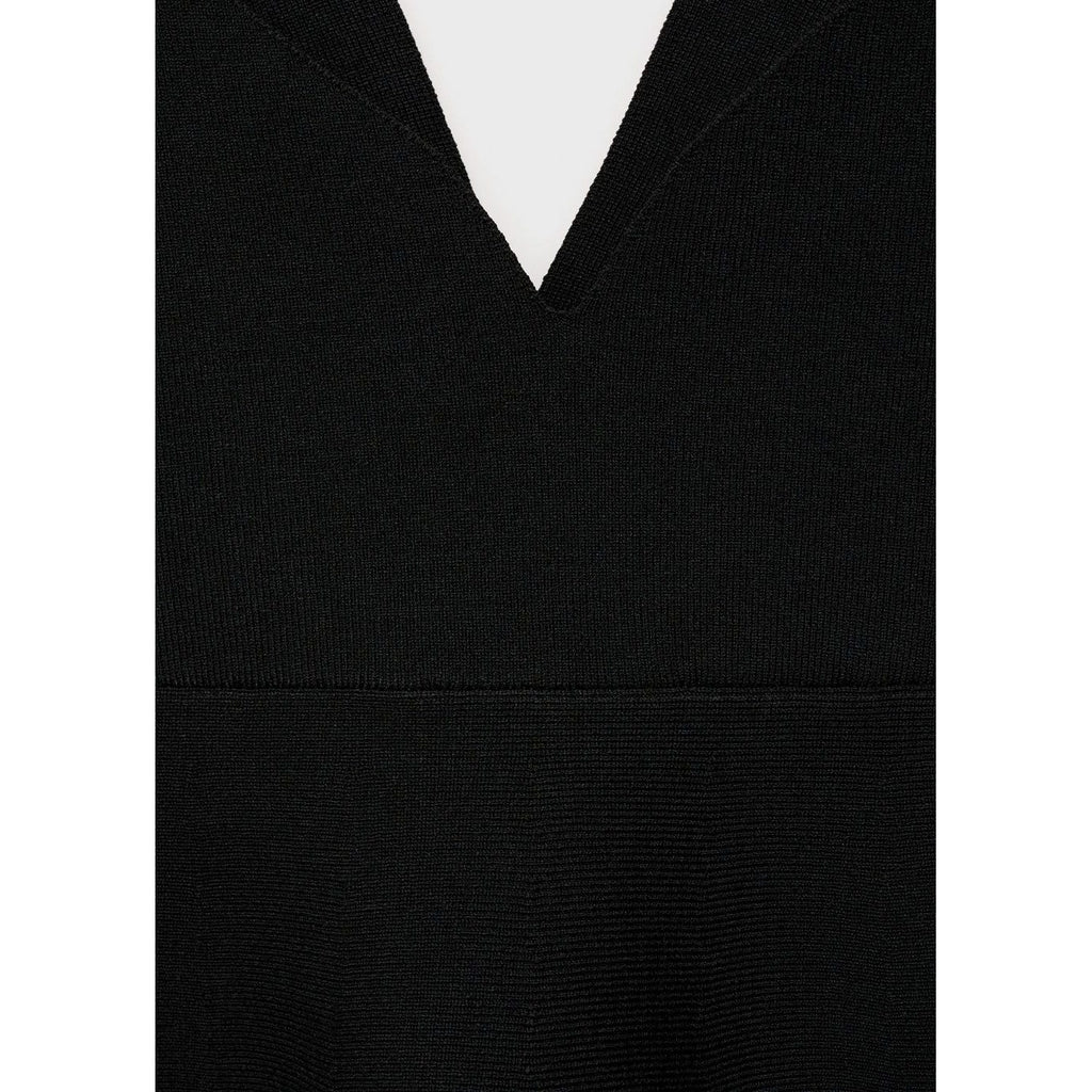 Top de punto fino con peplum