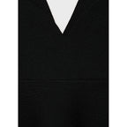 Top de punto fino con peplum
