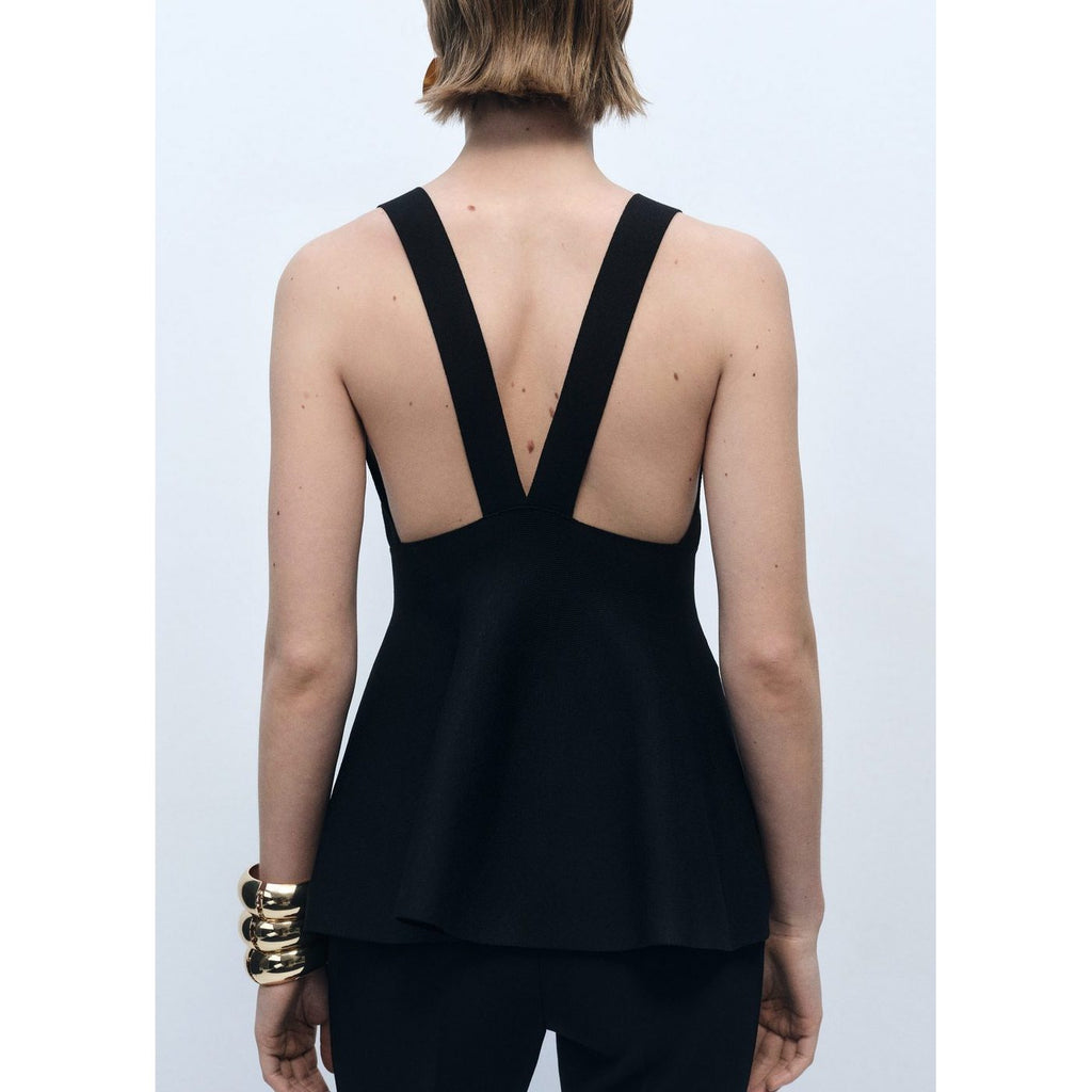 Top de punto fino con peplum