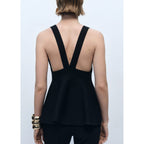 Top de punto fino con peplum