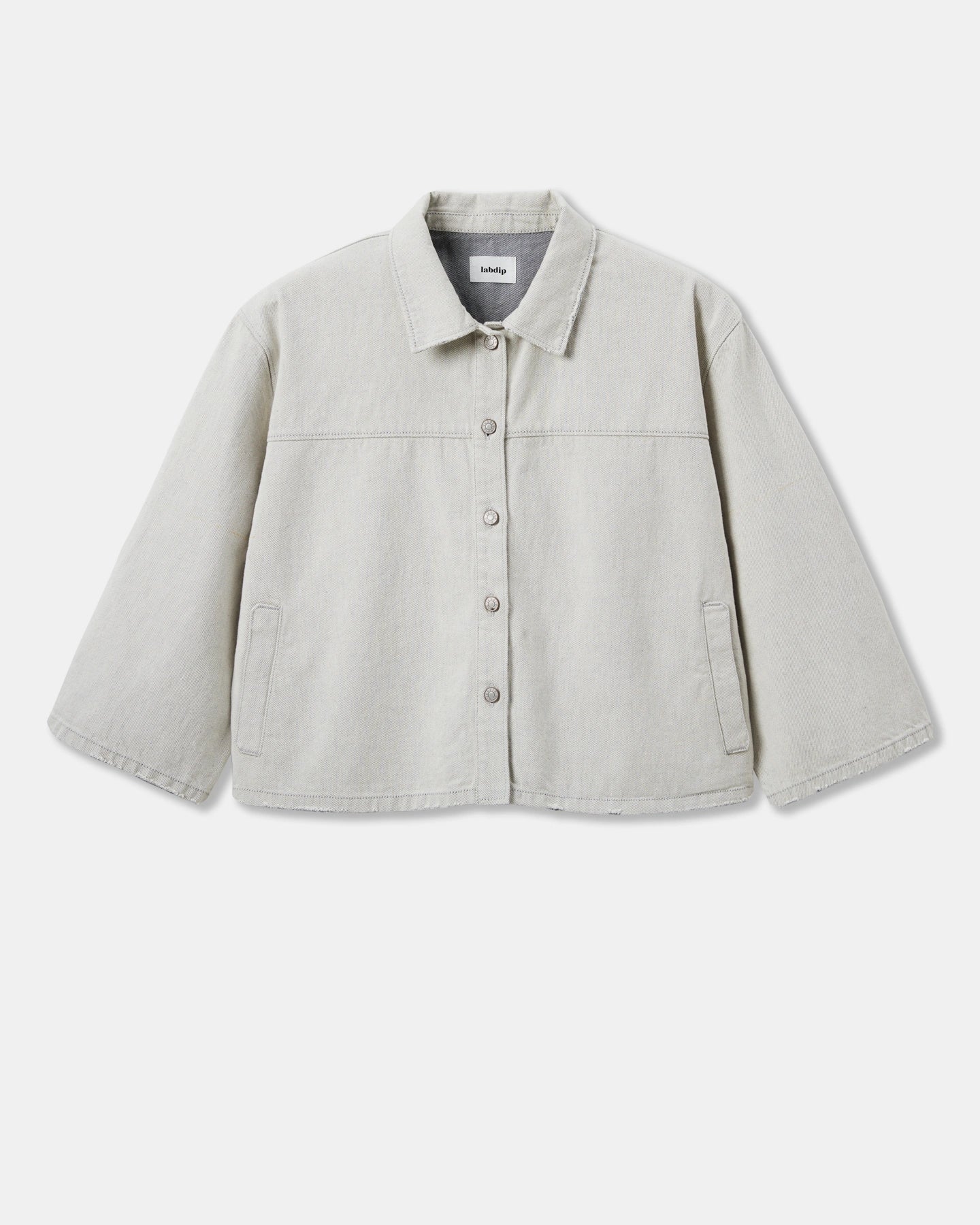 Oversized jacket in light granite undyed denim, straight cut with classic collar and front buttons, comfortable and breathable 100% cotton material.