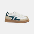 Zapatillas veganas cómodas con suela gruesa. La zapatilla es blanca con el logotipo verde