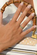 Anillo "Abaya" Diamantes 0.03/6 y Esmeraldas 0.60/3 - Oro blanco 375/1000