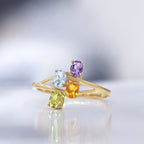 "Borneo" Ring: Amethyst 0.18/1, Blue Topaz 0.24/1, Citrine 0.18/1 and Peridot - 375/1000 Yellow Gold