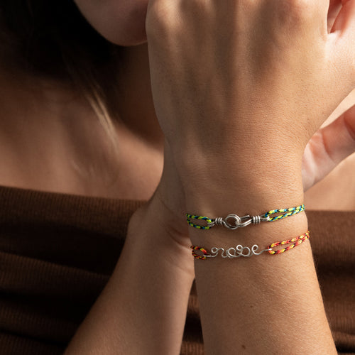 Detail of the hand-shaped 925 silver wire on technical cord