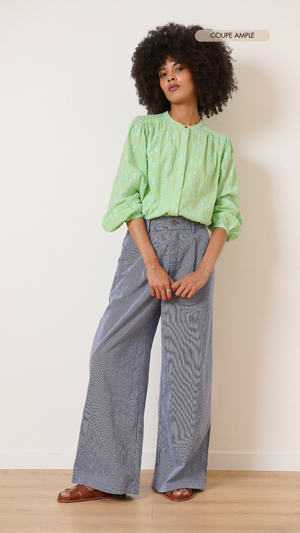 Green round-neck blouse with long buttoned sleeves and plumetis embroidery 