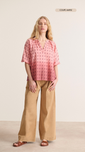 Loose blouse with 3/4 elasticated sleeves and gathers around the collar, satin embroidery material with hand-made dip dye