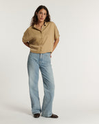 Flare jeans in light blue denim, loose and comfortable cut, soft material suitable for all female body shapes for a casual and summer style.
