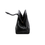 Black leather handbag with an open rope closure on a white background