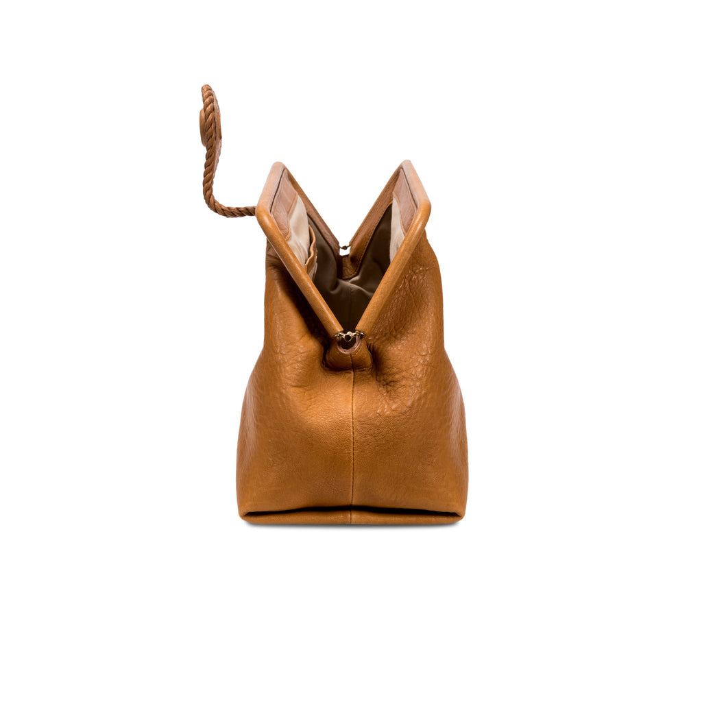 Light brown leather handbag with an open rope closure on a white background, shown from the side.