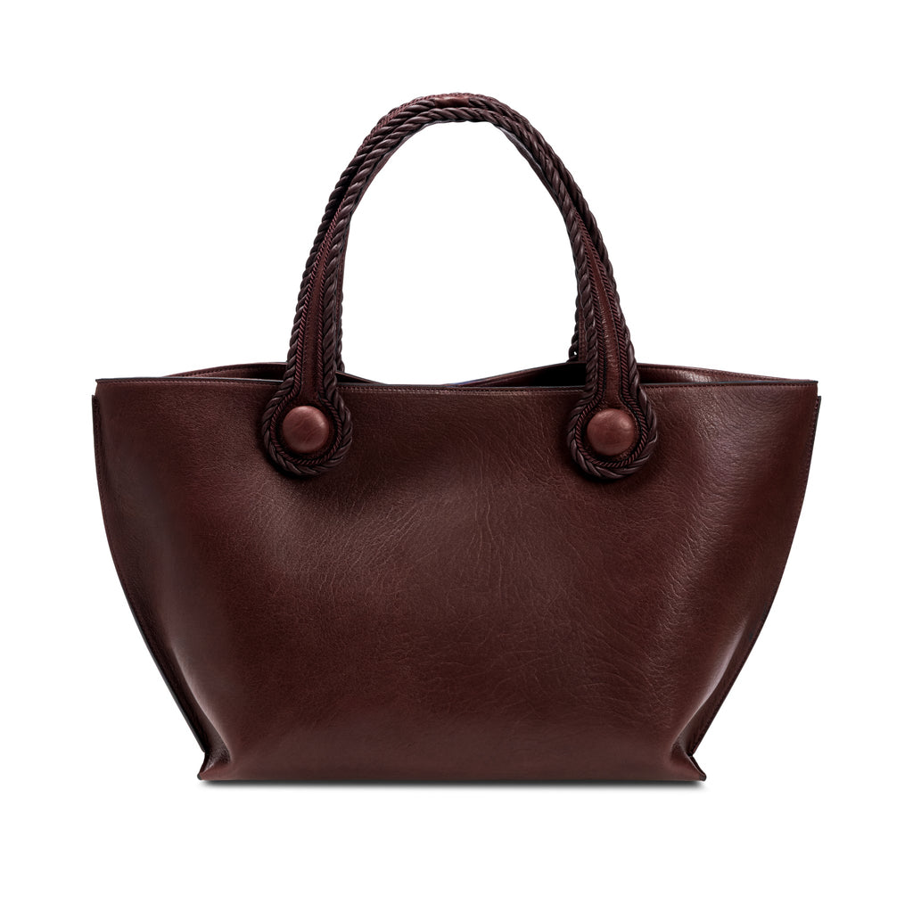 Burgundy leather in a shade of dark cherry tote bag with rope handles on a white background