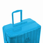 Poignée trolley télescopique GYL déployée sur la valise Intemporelle menthe en polycarbonate. #couleur_menthe