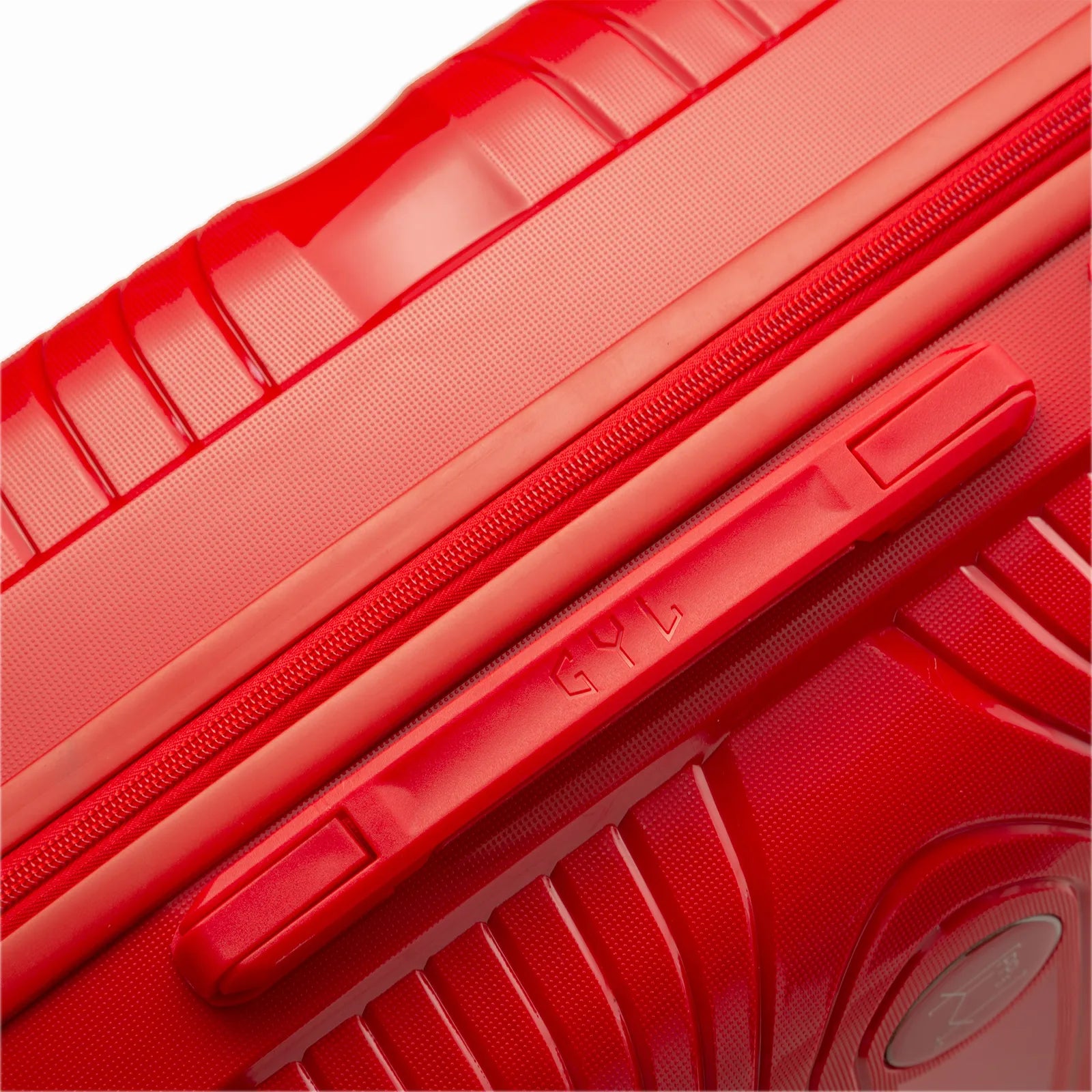 Detalle del asa lateral y del logo GYL en la maleta Signature roja. #couleur_rojo