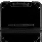 Top view of the GYL trunk suitcase in black polycarbonate, with central handle and reinforced corners. #couleur_noir