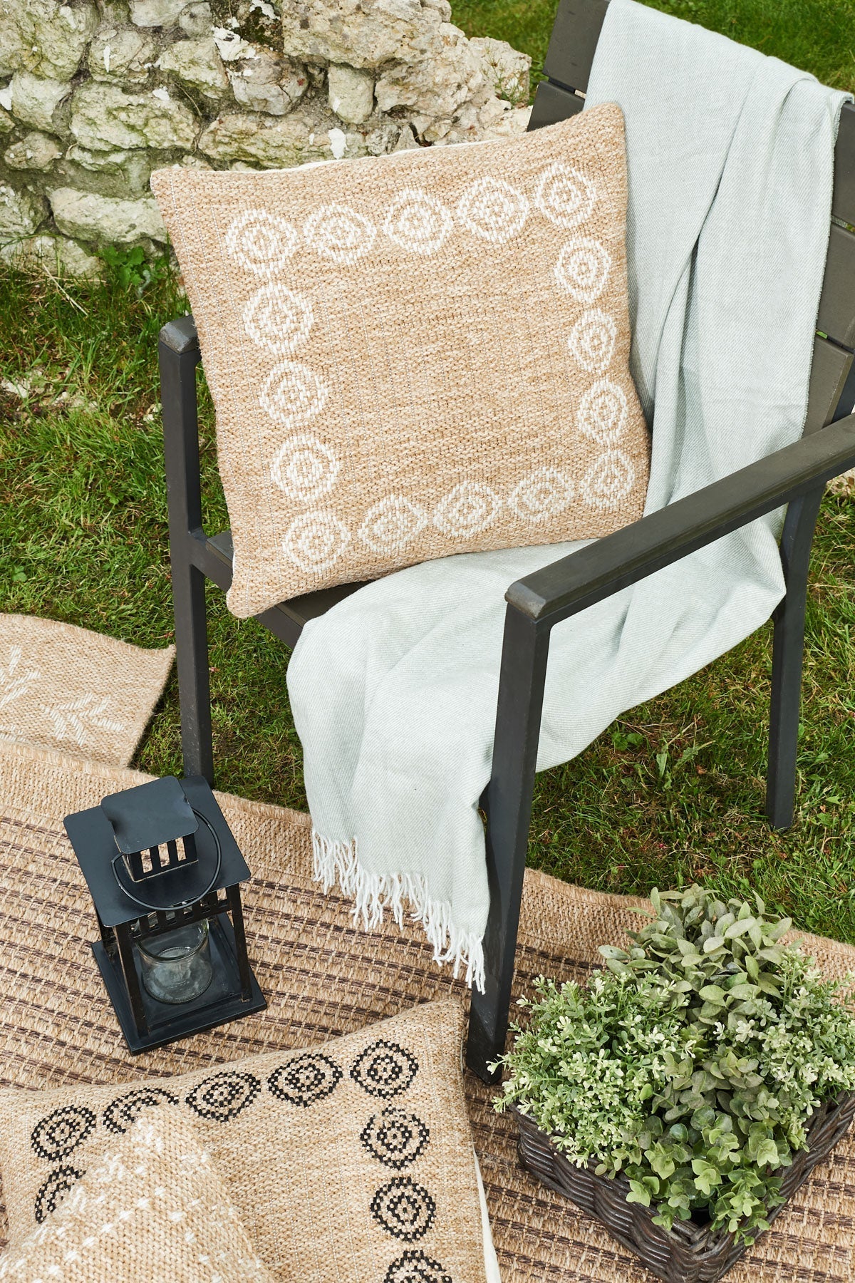 Funda de cojín redonda blanca con estampado efecto yute natural Alfombras Nazar