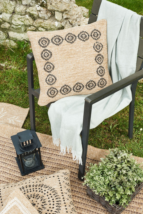 Funda de cojín redonda negra con estampado efecto yute natural Alfombras Nazar