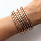 Tunn buddistisk armring - Champagne