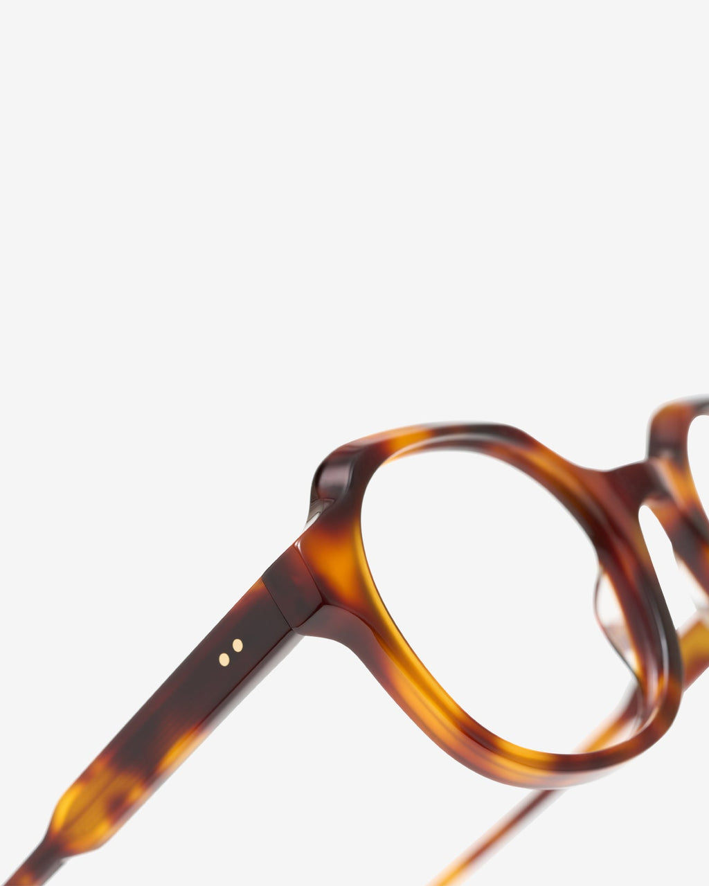 Close-up of the round acetate frame of the Flora Ecaille eyeglasses
