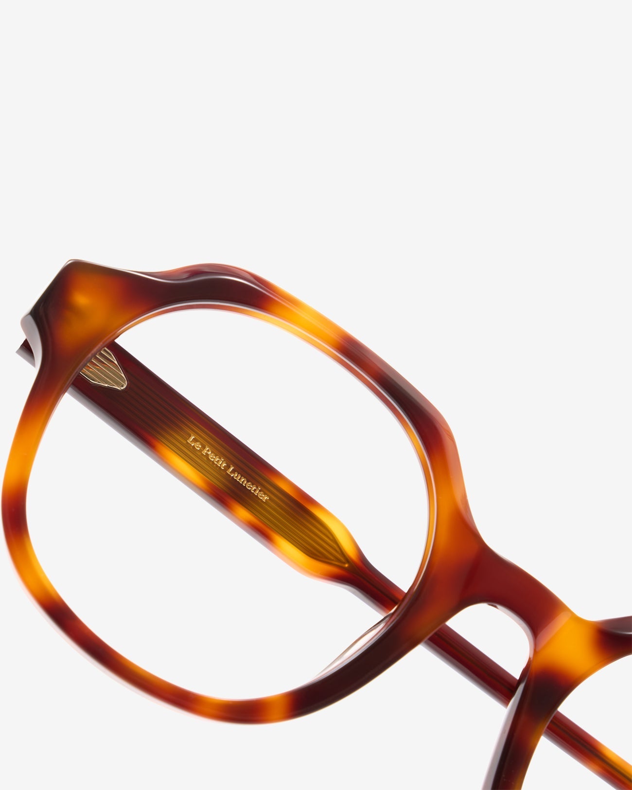 Flora Ecaille eyeglasses — round acetate frame, three-quarter view