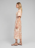 An'ge – Robe Longue Melila Josas Ocre, side view of blonde female model wearing a beige and pink printed maxi dress