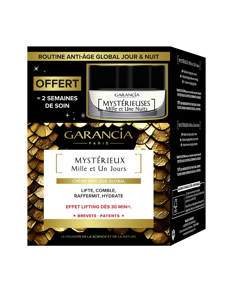 Packaging of the gold and black box containing the jar of Mystérieux day cream and a free night miniature