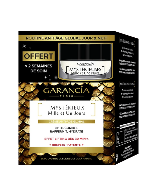 Packaging of the gold and black box containing the jar of Mystérieux day cream and a free night miniature