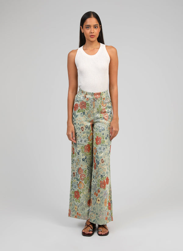 An'ge – Phionaly Lime Trousers, model wearing a white tank top and floral trousers