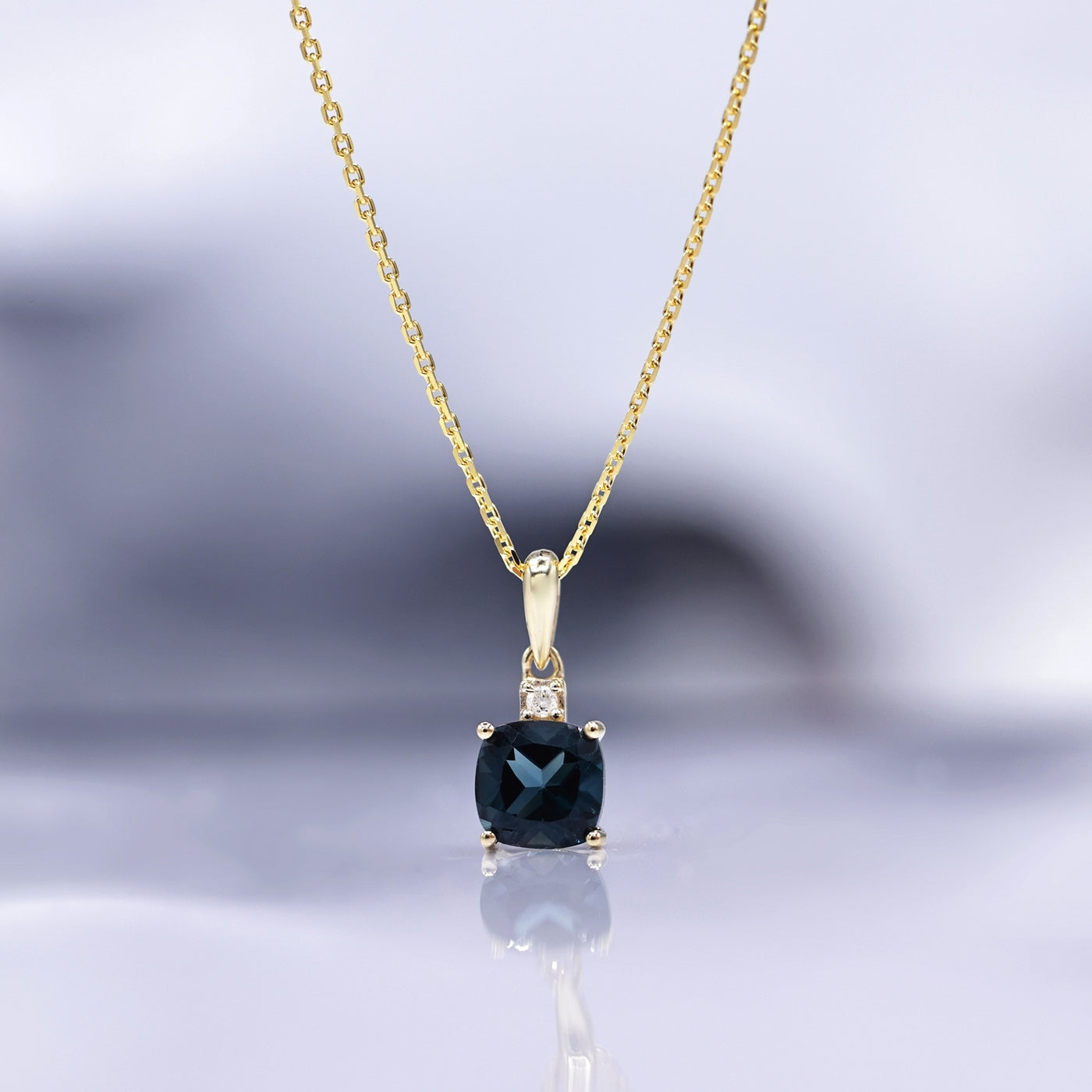 "Tonga" Pendant D0.016/1 &amp; London Blue Topaz 1.32/1 - 375/1000 Yellow Gold