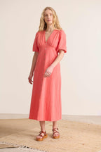 Midi length dress, 2/4 elasticated and slightly puffed sleeves, dress with slit at the front 