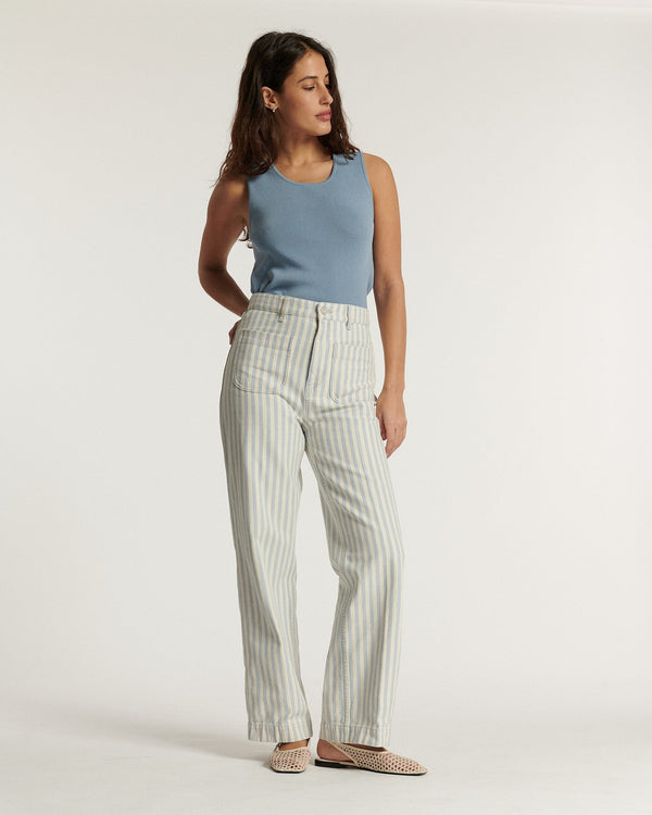 Women's jeans in beige and light blue striped denim, straight and comfortable cut, 100% cotton fabric suitable for all body shapes.