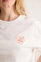 Haut blanc à col rond avec broderie fleur orange forme oversize 100% coton 