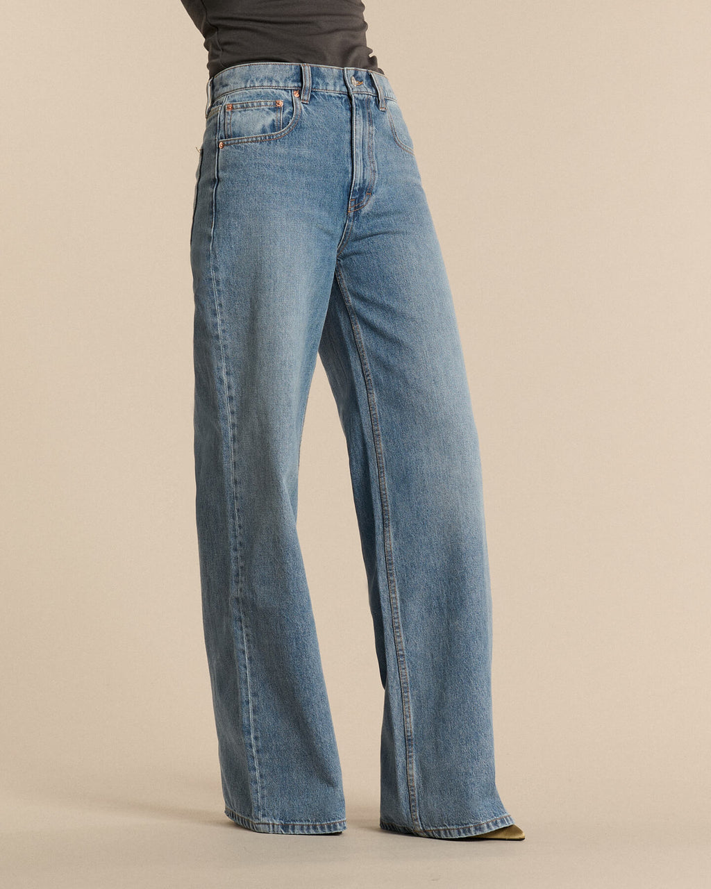 Light blue cotton denim jeans with straight cut and loose length, offering a comfortable style suitable for all female body shapes.