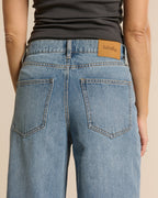 Light blue 100% cotton denim jeans with a wide fit and high waist, comfortably fitting all female body shapes.