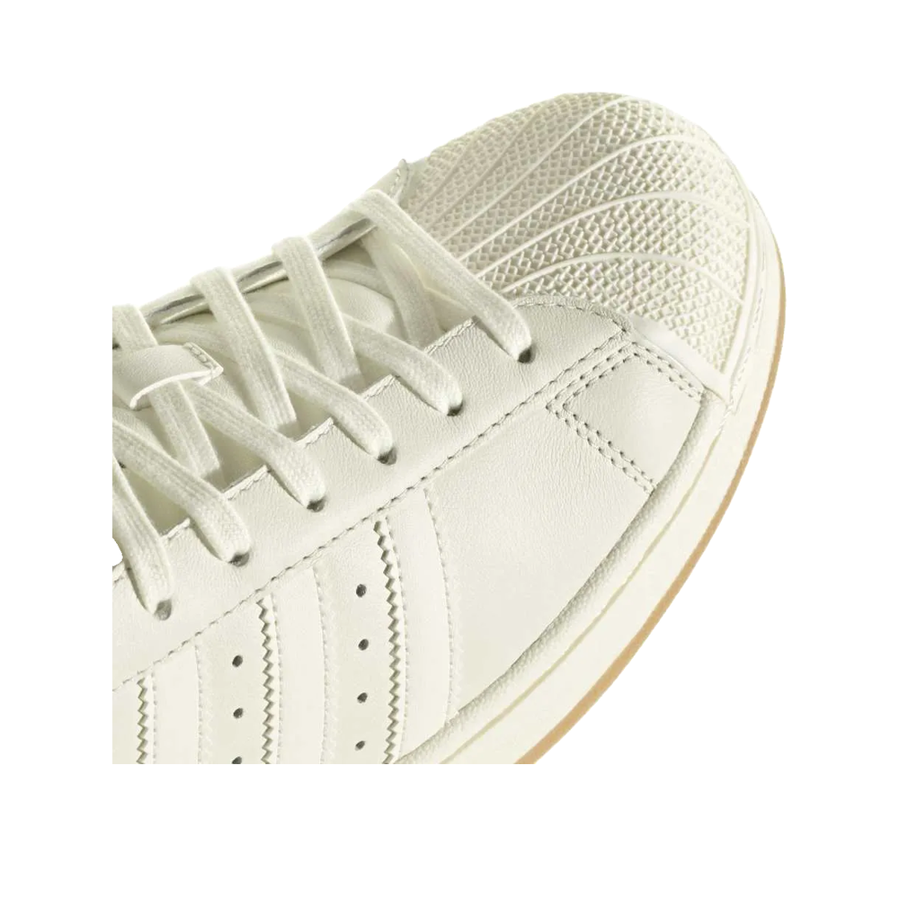 Adidas Superstar Messi – Unisex-Sneaker Elfenbein/Gold
