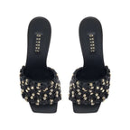 Aurnia Black High-Heel Sandal featuring a stylish woven design with gold accents, perfect for elevating any outfit.