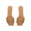 Aurnia Latte Flat Sandal featuring stylish woven straps and a comfortable flat sole, perfect for casual summer outings.