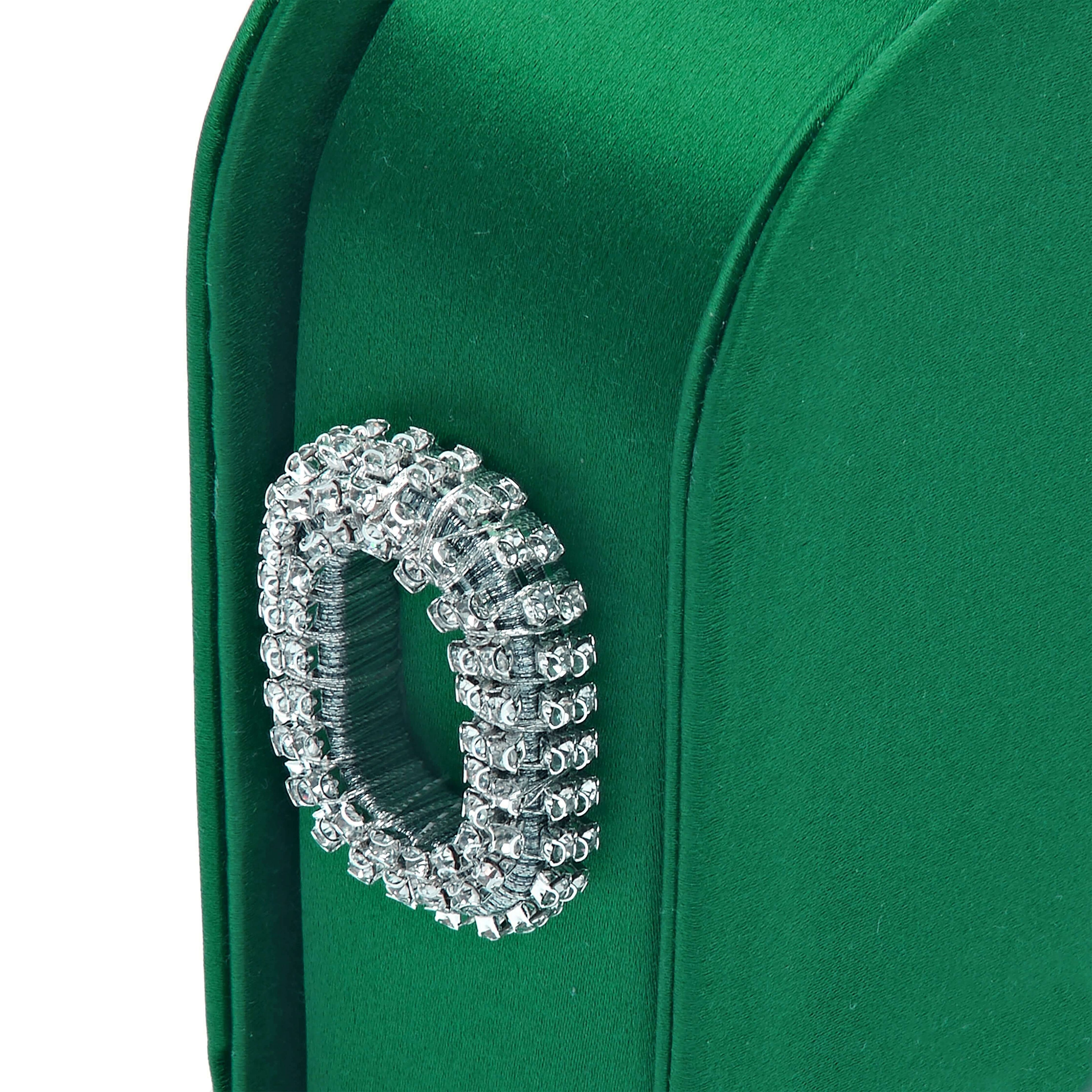 Close-up of Catena Emerald One Two Sided Clutch with crystal embellishment and luxurious green silk satin fabric.