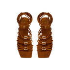 Catena Notte Camello flat lace-up sandal with suede straps and metallic details, perfect for summer adventures.