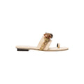 Delphine Nude Flat Toe Sandal featuring earthy beads and a comfortable wide strap, embodying nature's serene tones.
