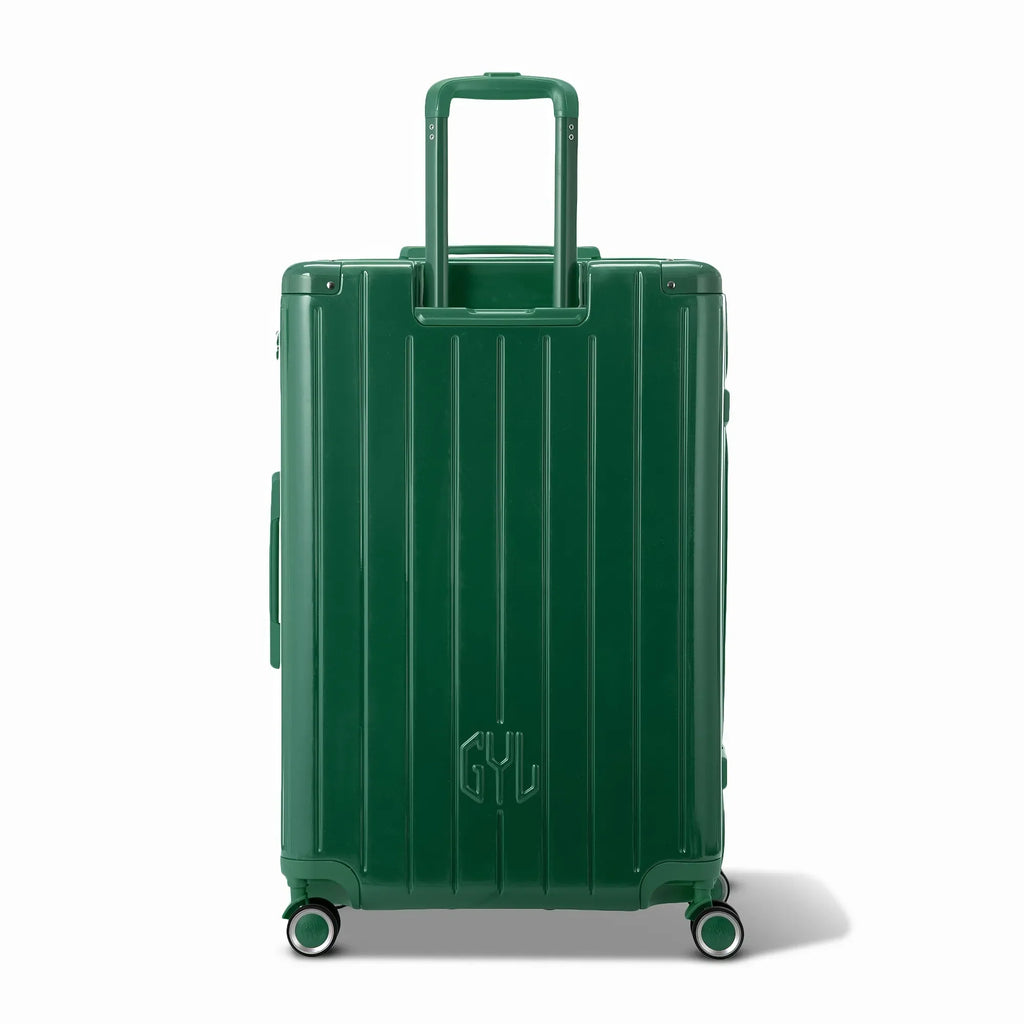 Rear view of the GYL Intemporelle fir green hard-shell suitcase with integrated handles and swivel wheels. #couleur_sapin