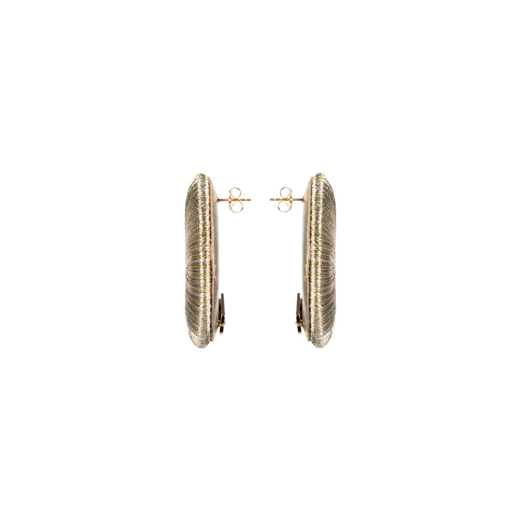 Close-up view of Boho Gold Silver Earring showcasing intricate hand-wrapped metallic threads in circular design.