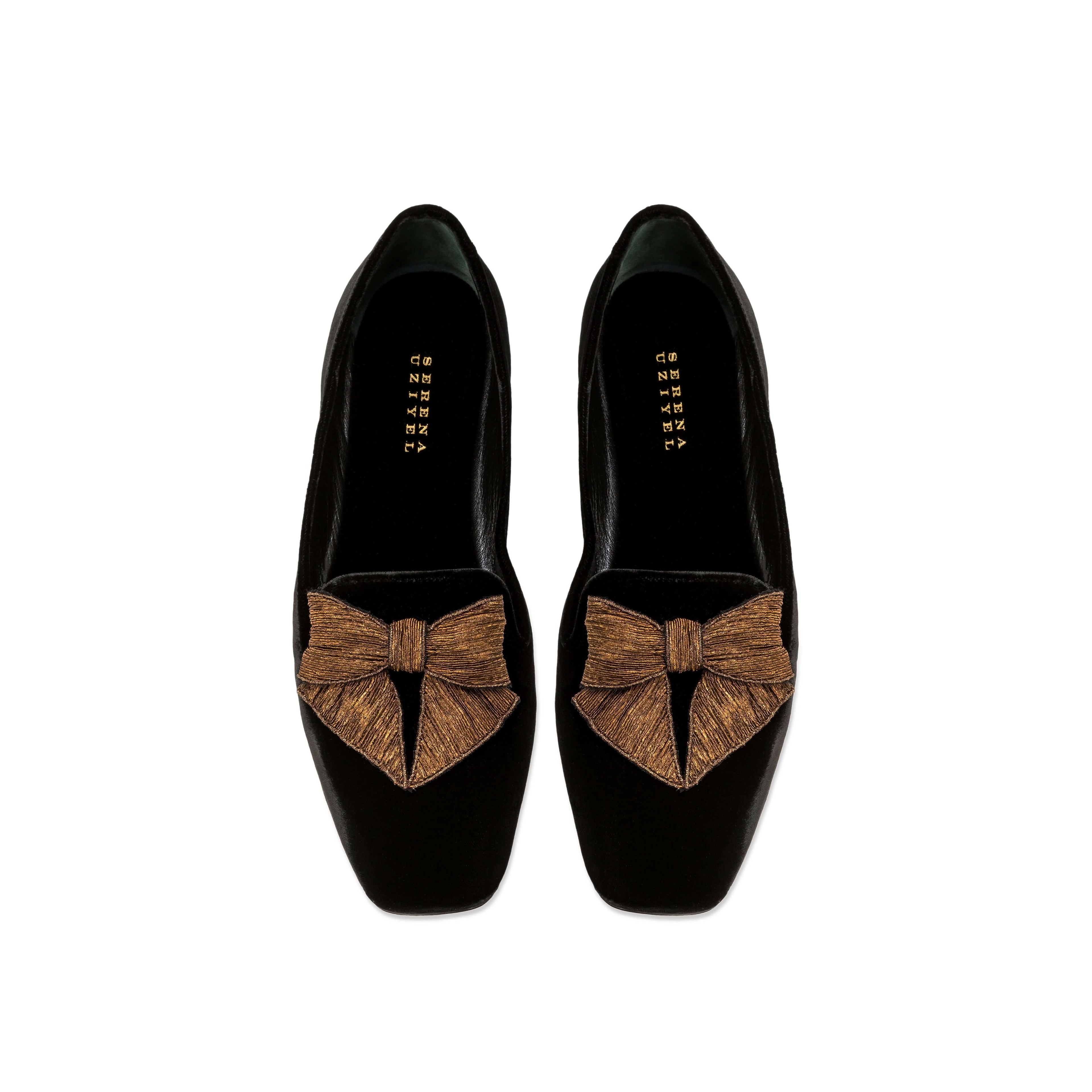 Fiocco black velvet flat moccasin with antique gold embroidered bow, highlighting comfort and chic autumn style.