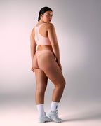woman wearing a seamless sports thong hastko STRING N°19 #color_nude