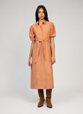 An'ge – Malida Maxi Dress Terracotta, peach-coloured long shirt dress worn by a model, front view